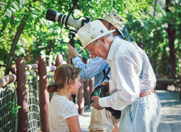 Sofia taking a photography lecture from Paul