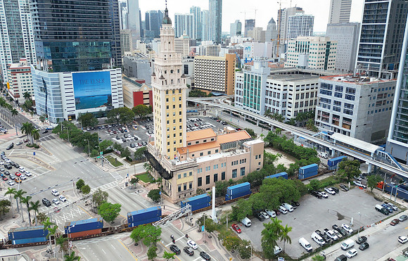 Freedom Tower and train crossing to Port of Miami